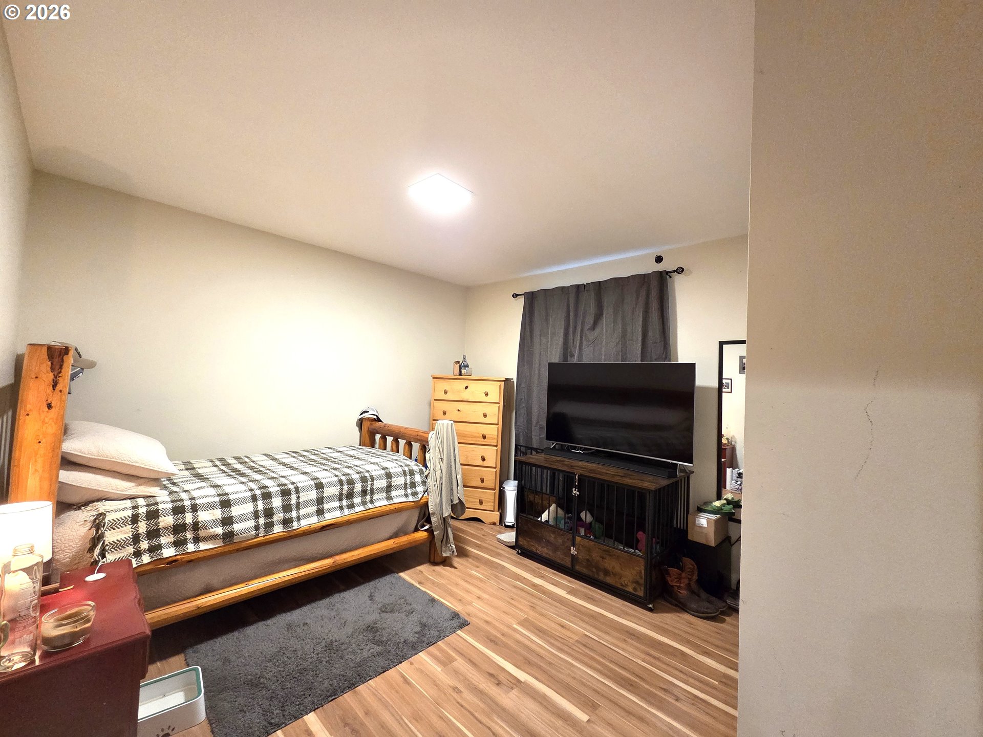 2904 North 3rd Street La Grande, OR 97850 - Photo 7 of 14 a living room with a bed furniture and a flat screen tv