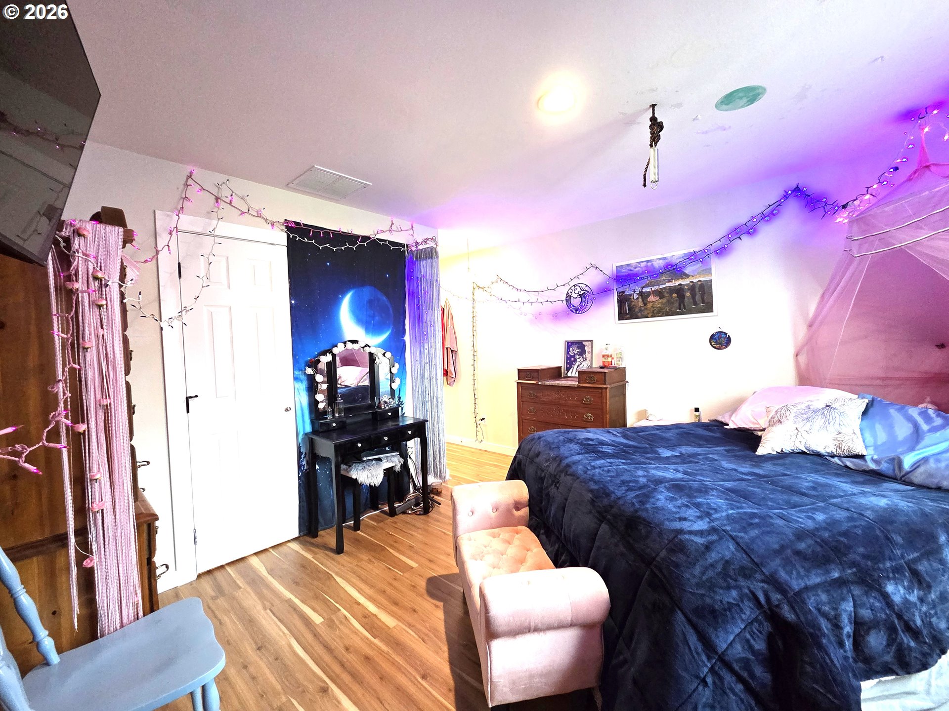 2904 North 3rd Street La Grande, OR 97850 - Photo 10 of 14 a bedroom with a bed and a chandelier