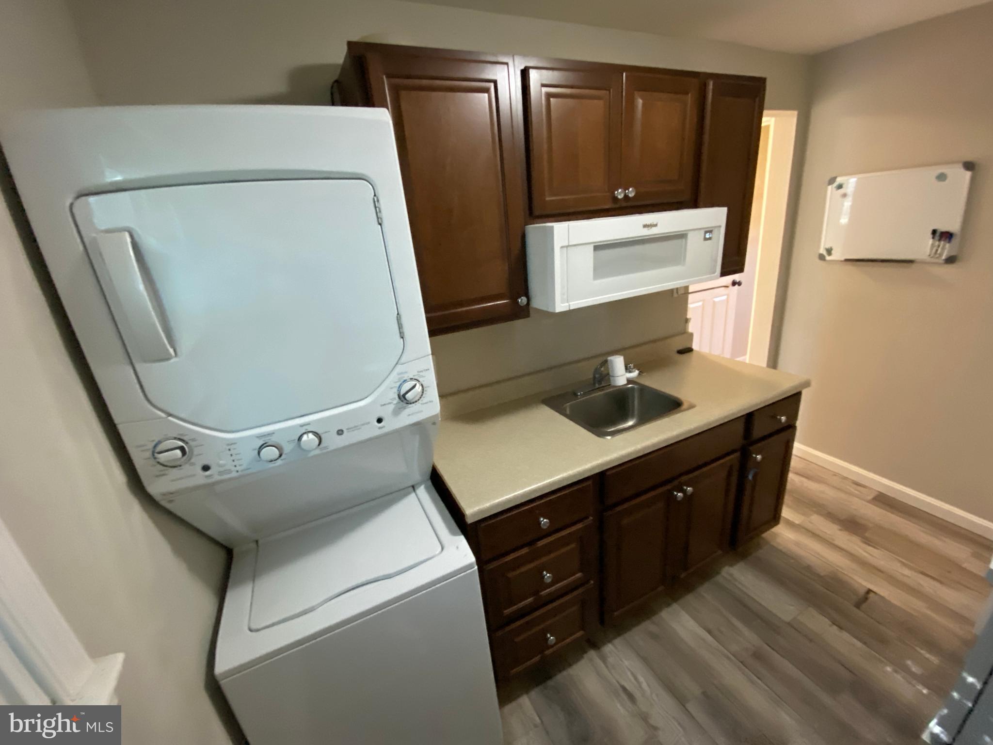 205 North Irving Avenue Colonial Beach, VA 22443 - Photo 19 of 22 a bathroom with a sink a toilet and mirror