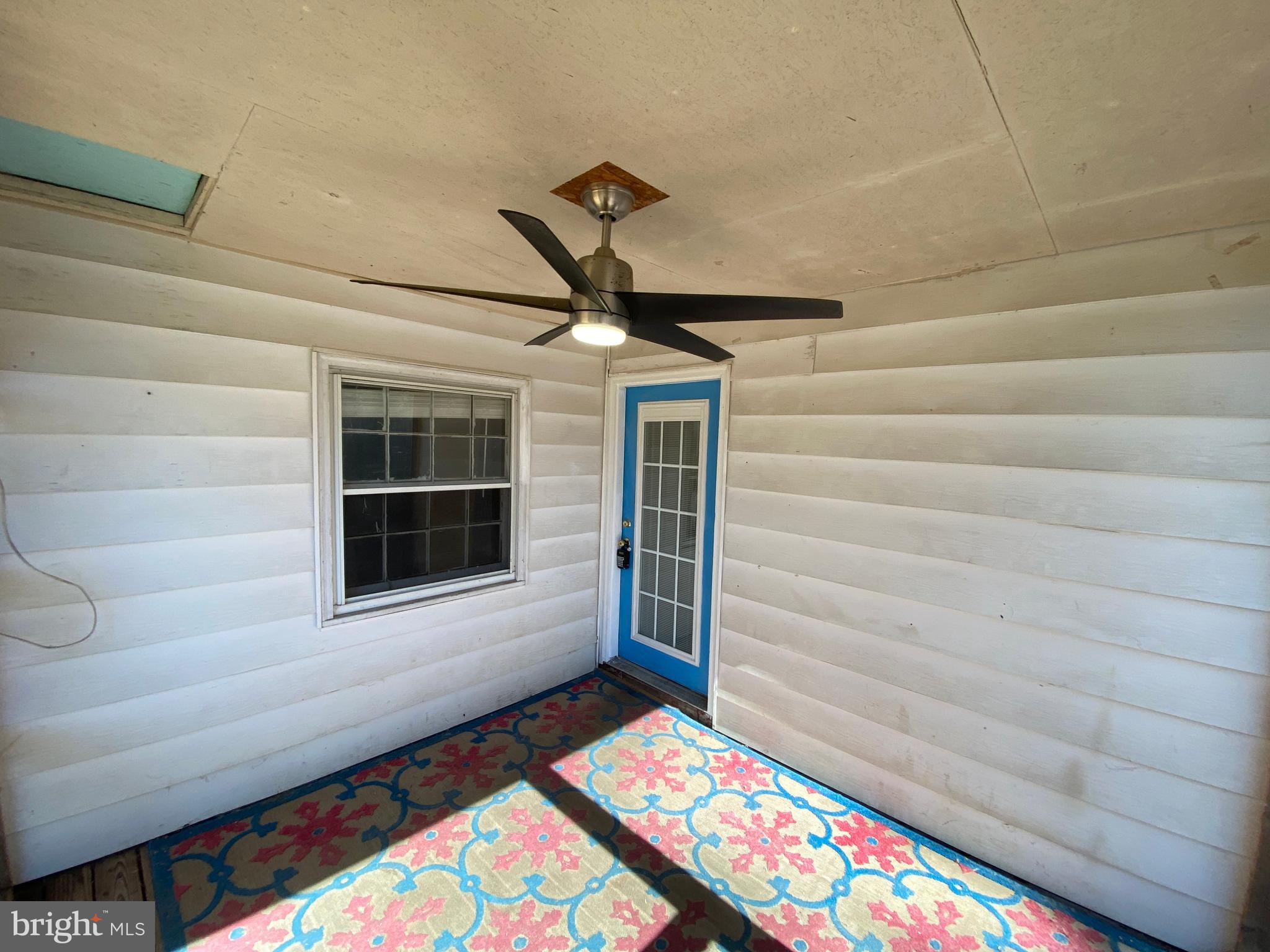 205 North Irving Avenue Colonial Beach, VA 22443 - Photo 5 of 22 a front view of a house with wooden floor