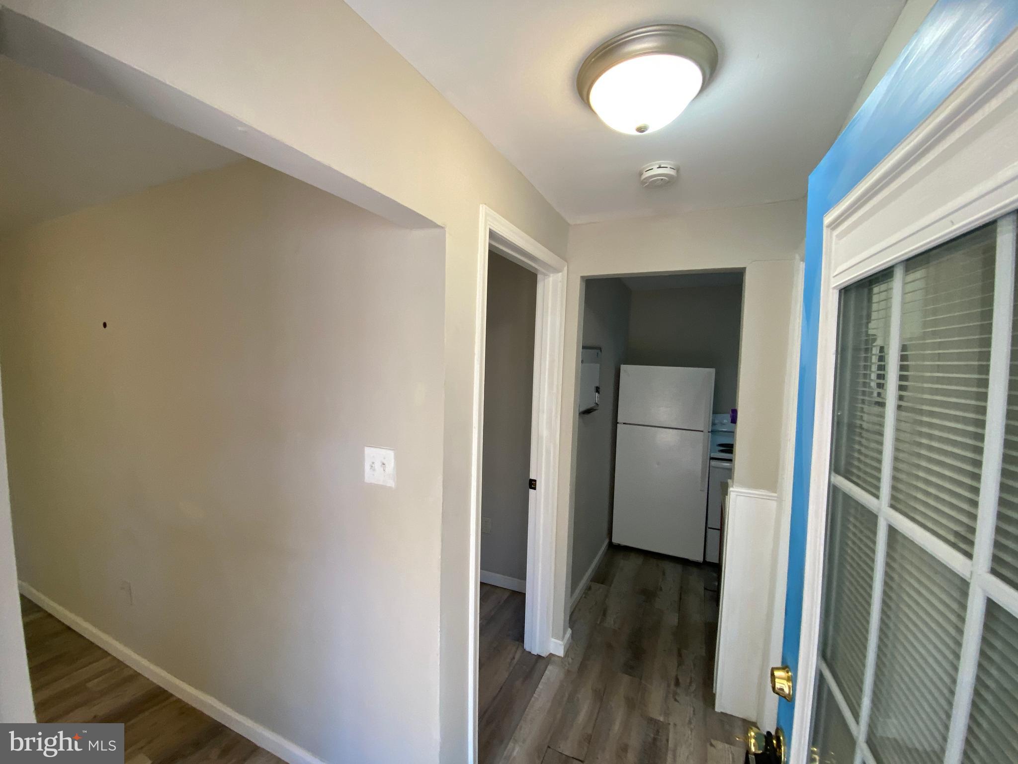 205 North Irving Avenue Colonial Beach, VA 22443 - Photo 6 of 22 a view of hallway with wooden floor