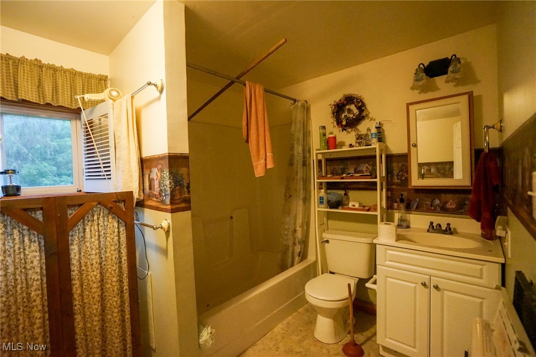34799 Paw Road Lower Salem, OH 45745 - Photo 10 of 50 Bathroom featuring shower / bath combo, vanity, and light tile patterned flooring