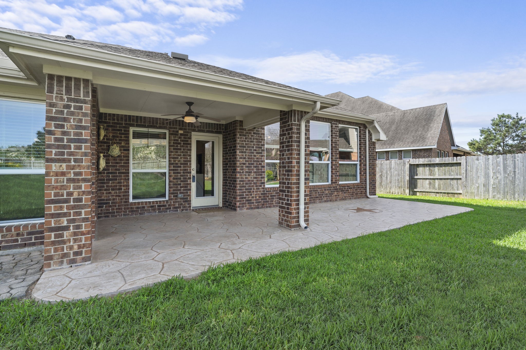 3426 Summer Ranch Drive Katy, TX 77494 - Photo 32 of 48 Step outside to a covered patio designed for year-round enjoyment, offering a shaded space perfect for outdoor dining, relaxing, or weekend gatherings.