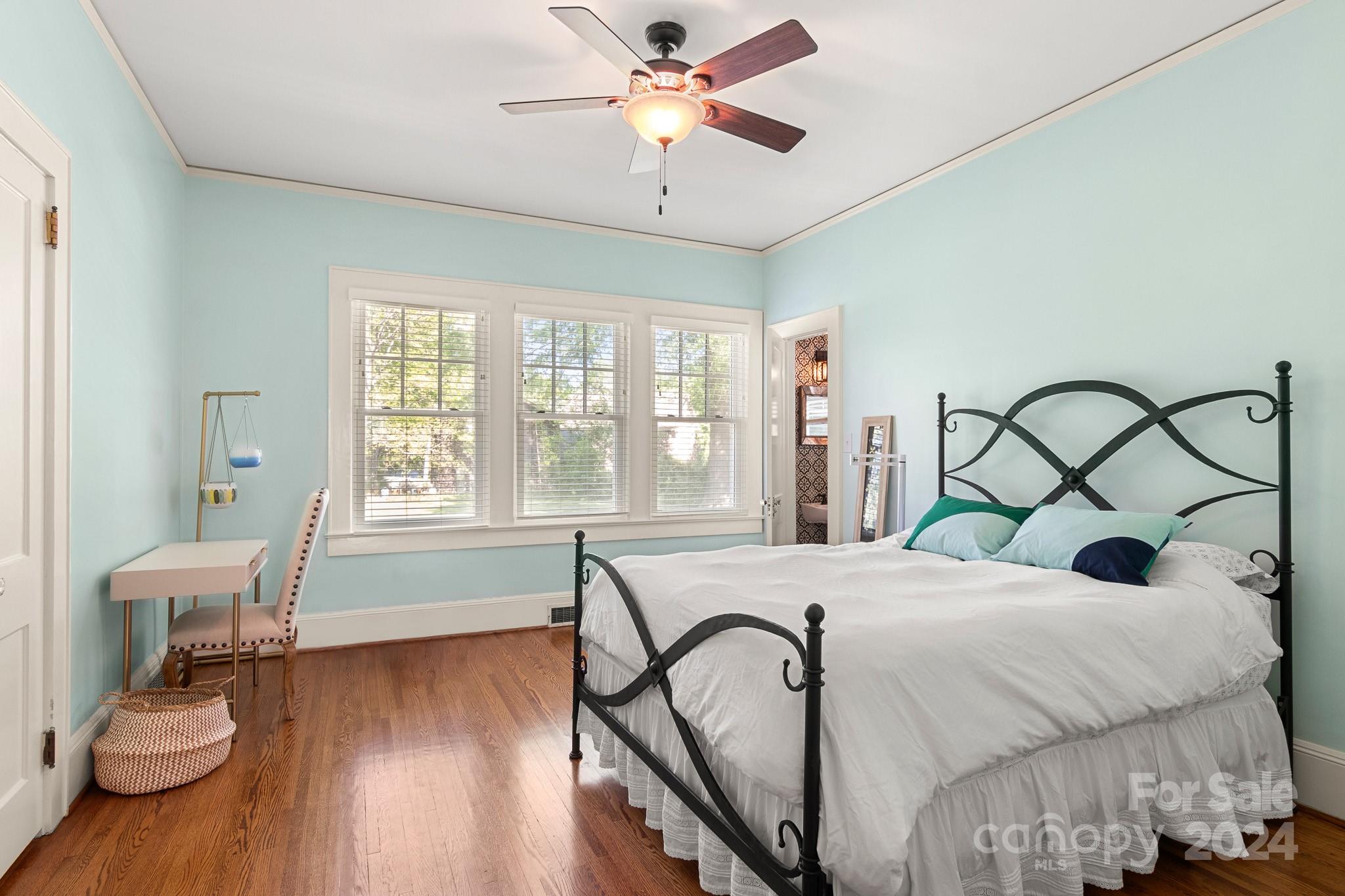 221 Ridgeway Avenue Statesville, NC 28677 - Photo 19 of 45 a bedroom with a bed and wooden floor