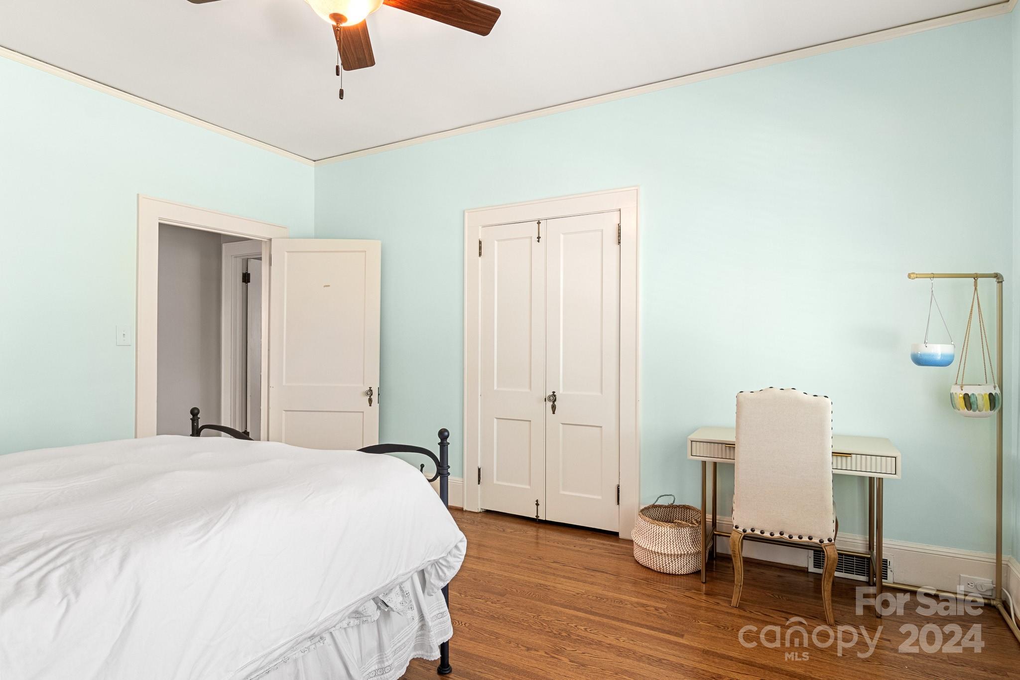 221 Ridgeway Avenue Statesville, NC 28677 - Photo 20 of 45 a bedroom with a bed and a chair