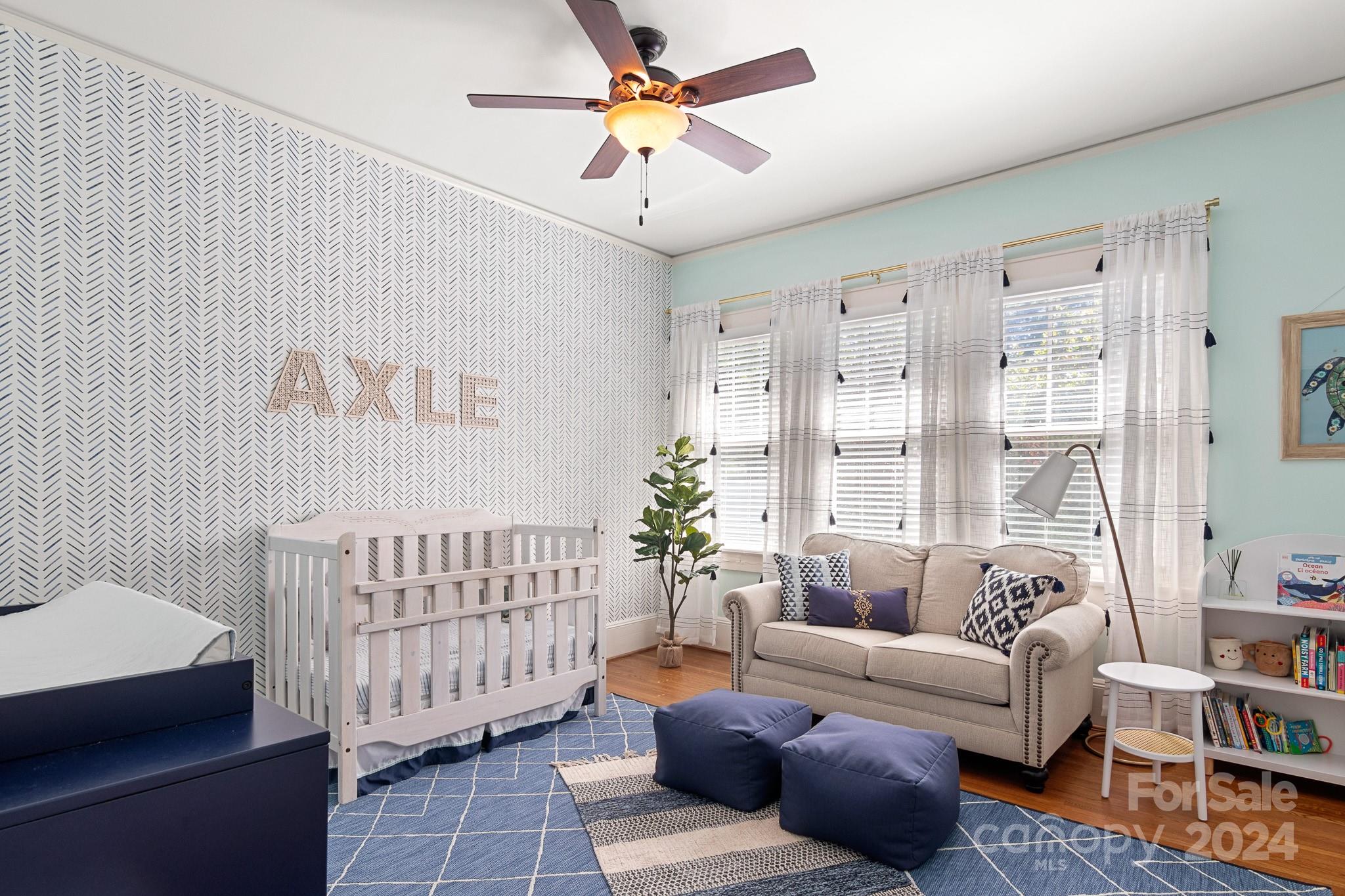 221 Ridgeway Avenue Statesville, NC 28677 - Photo 22 of 45 a living room with furniture and a chandelier