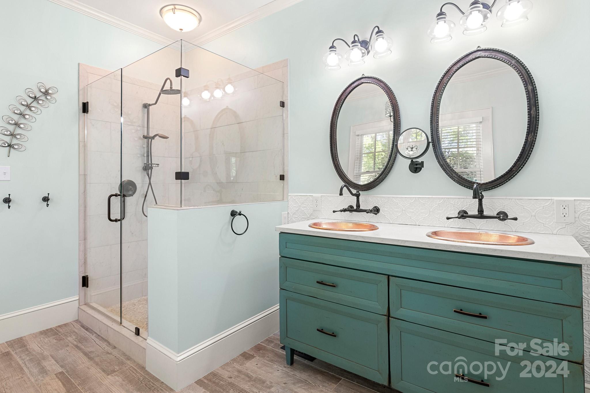 221 Ridgeway Avenue Statesville, NC 28677 - Photo 30 of 45 a bathroom with a double vanity sink mirror and shower