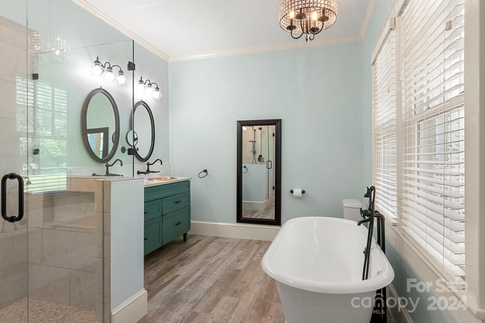 221 Ridgeway Avenue Statesville, NC 28677 - Photo 32 of 45 a bathroom with a sink a mirror and a window