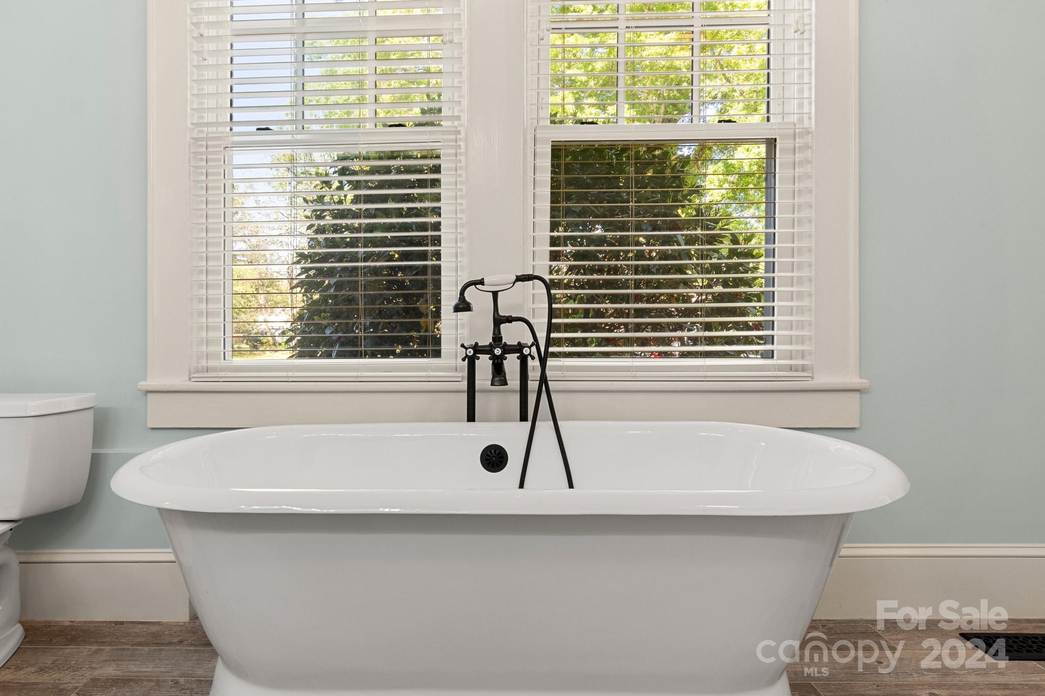 221 Ridgeway Avenue Statesville, NC 28677 - Photo 34 of 45 a bathroom with a bathtub and a window