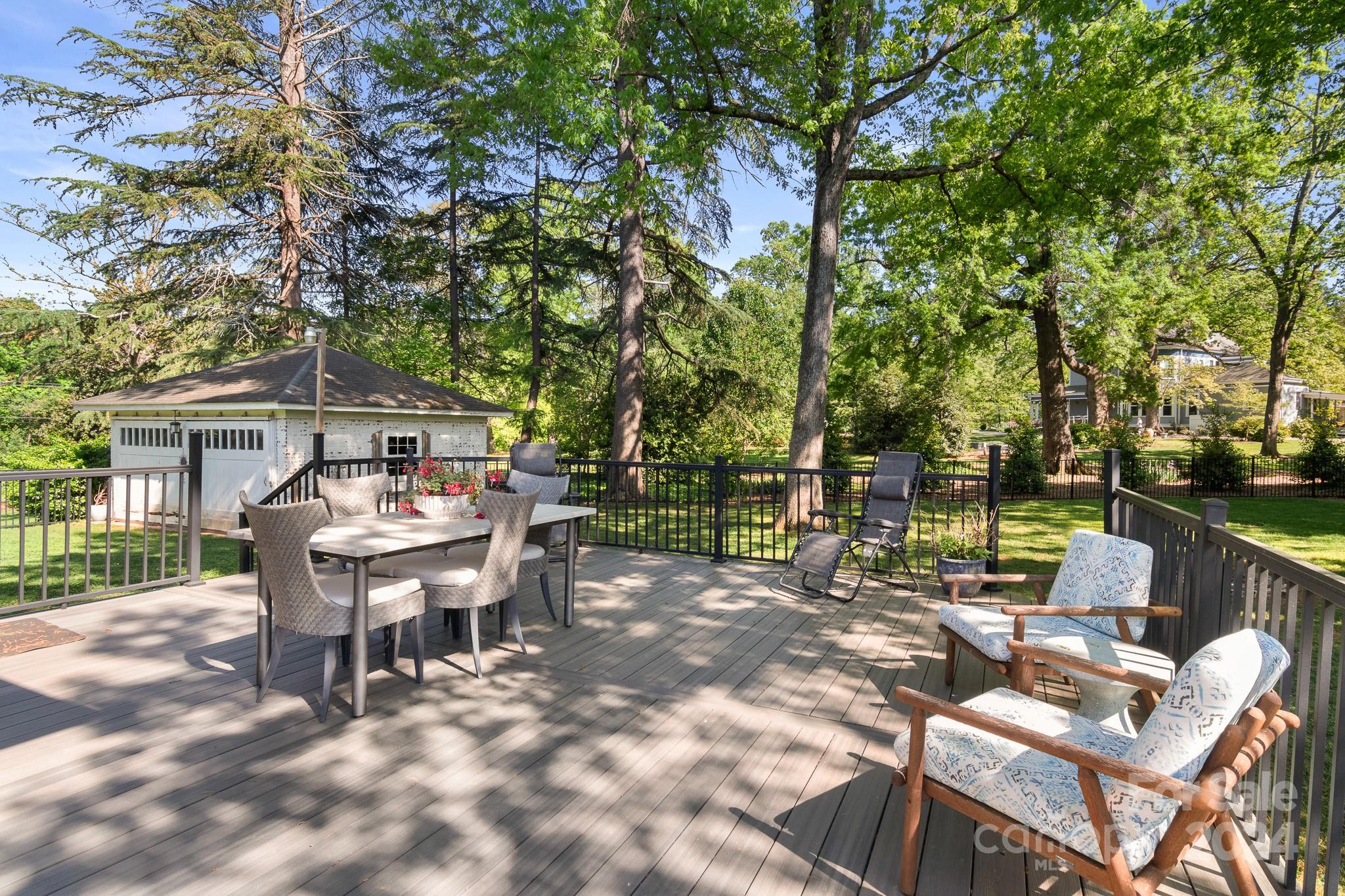 221 Ridgeway Avenue Statesville, NC 28677 - Photo 38 of 45 a view of a chairs and table in backyard of a house
