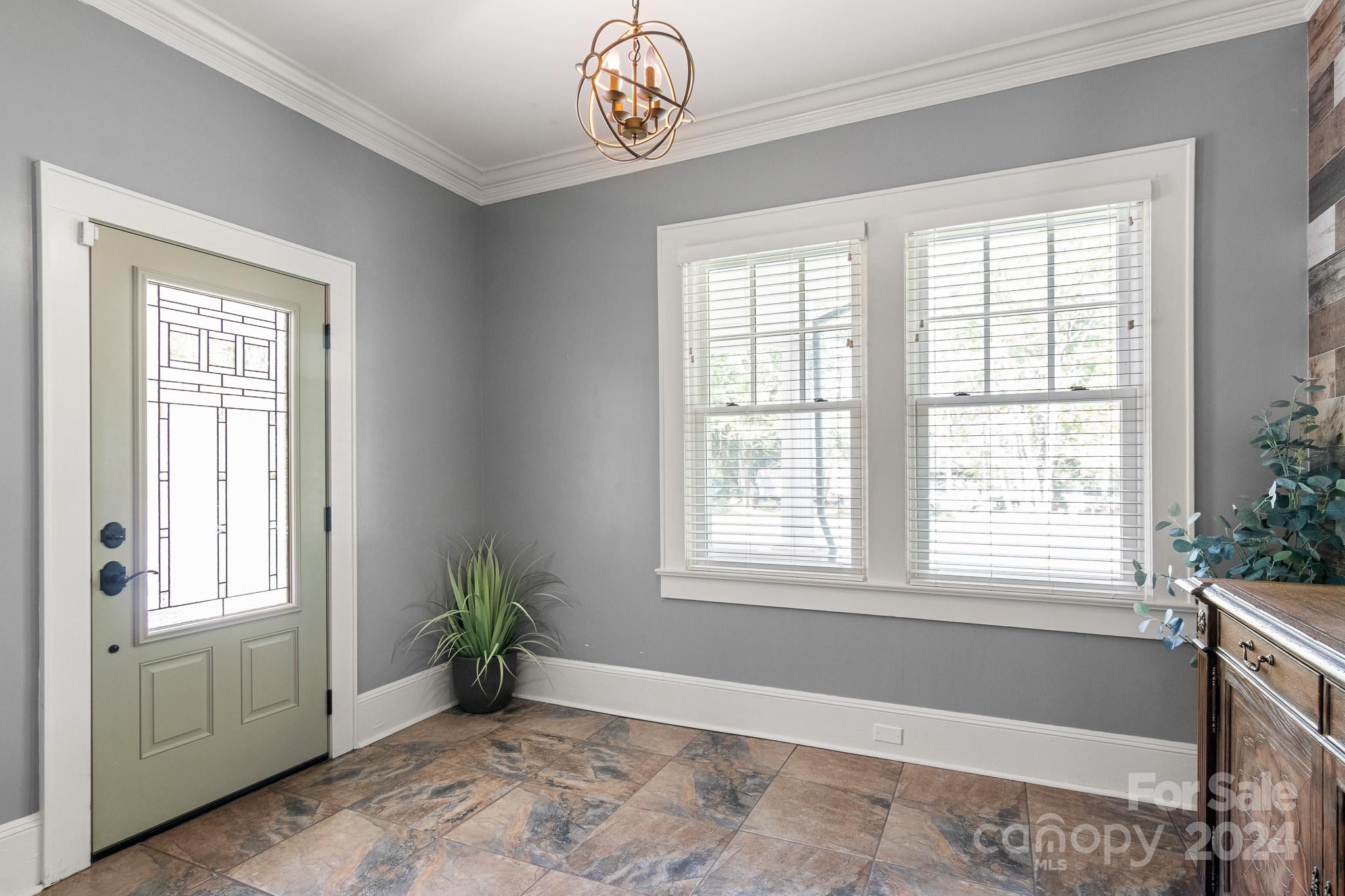 221 Ridgeway Avenue Statesville, NC 28677 - Photo 4 of 45 a view of an empty room with window and hardwood floor