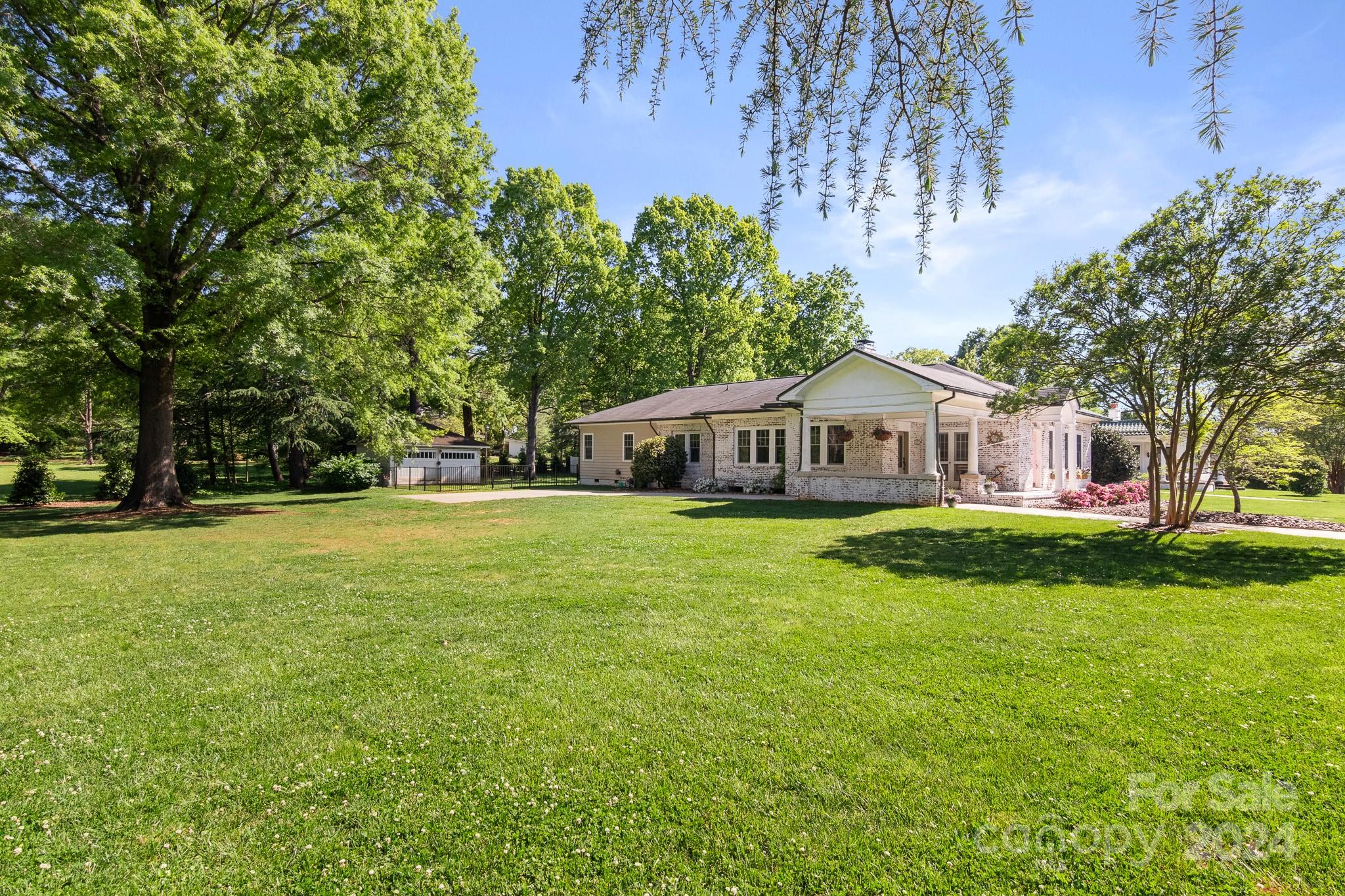 221 Ridgeway Avenue Statesville, NC 28677 - Photo 43 of 45 a front view of a house with garden