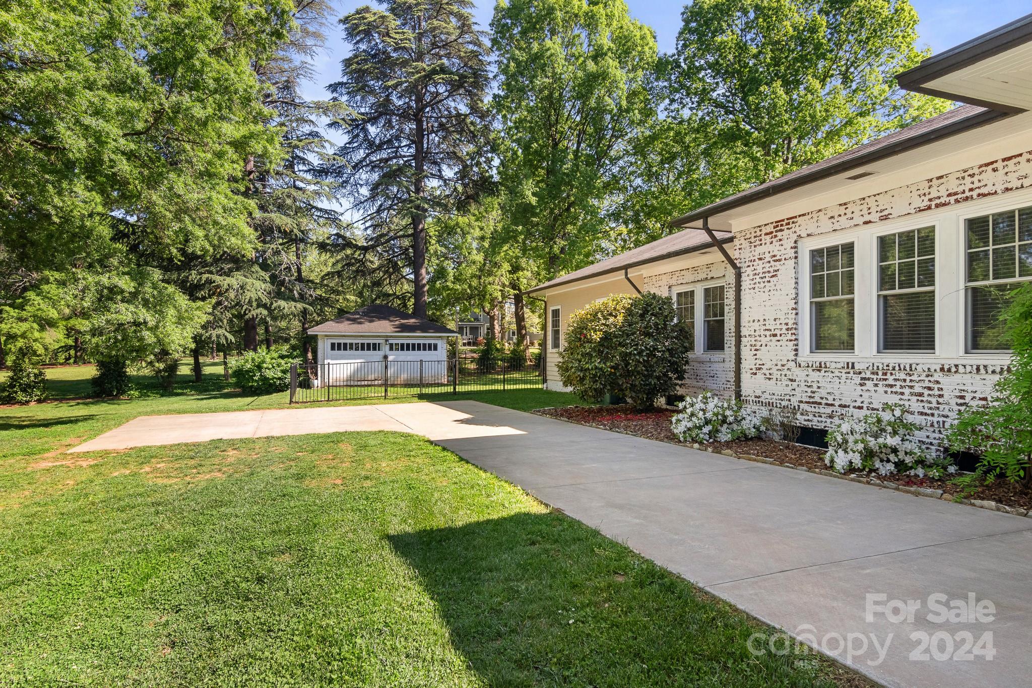 221 Ridgeway Avenue Statesville, NC 28677 - Photo 45 of 45 a front view of a house with garden