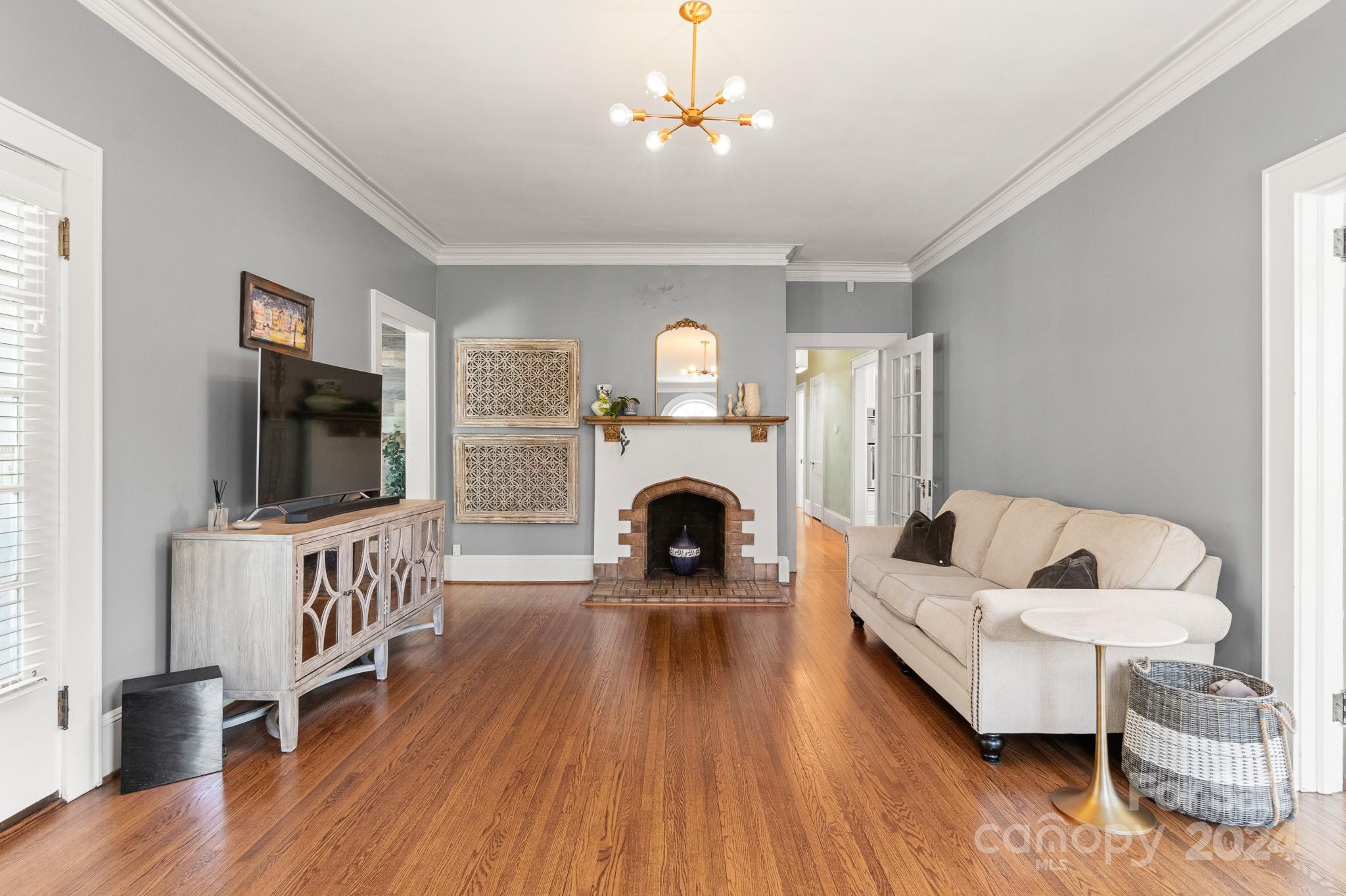 221 Ridgeway Avenue Statesville, NC 28677 - Photo 5 of 45 a living room with furniture and a fireplace