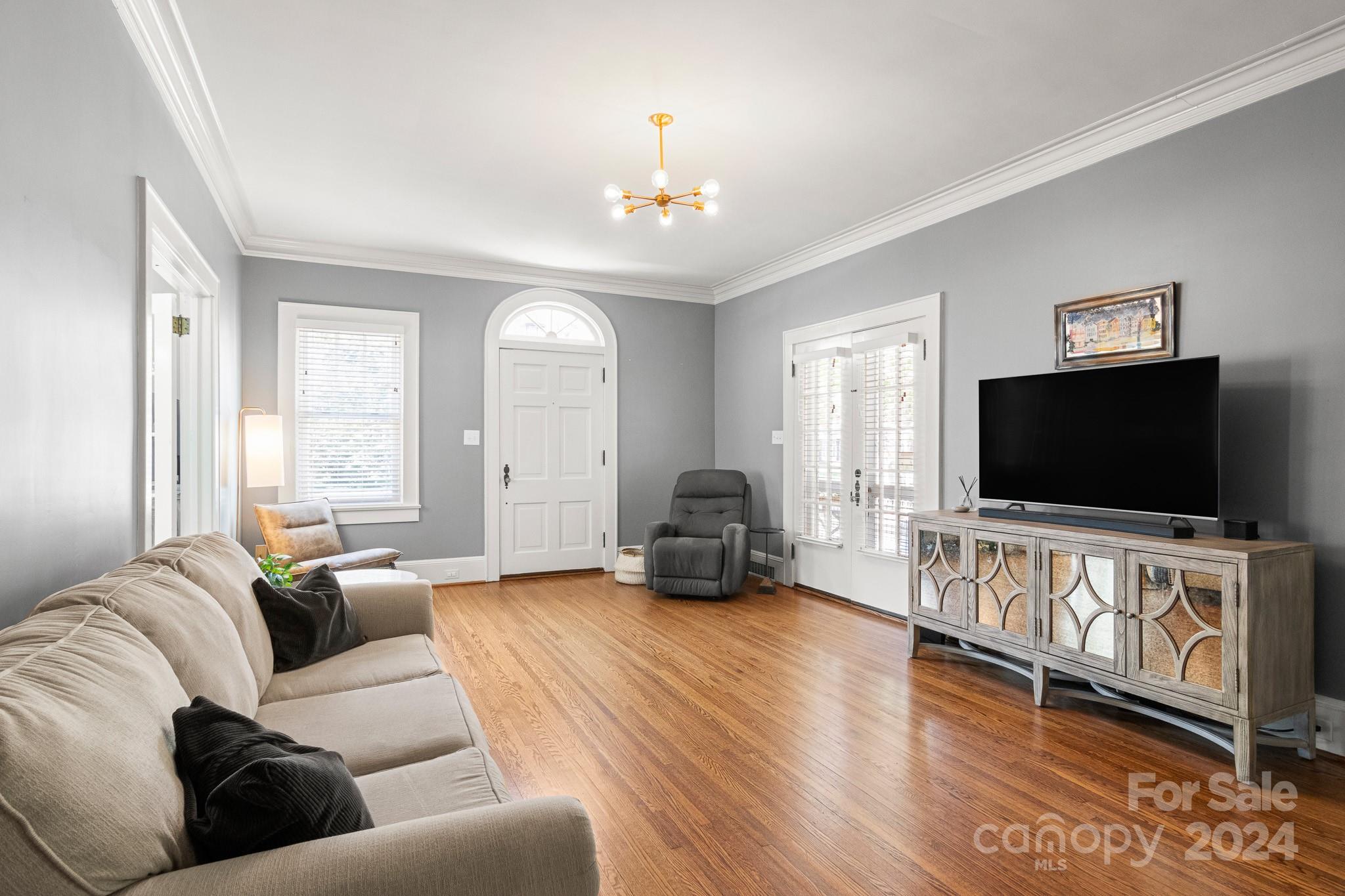 221 Ridgeway Avenue Statesville, NC 28677 - Photo 6 of 45 a living room with furniture and a flat screen tv