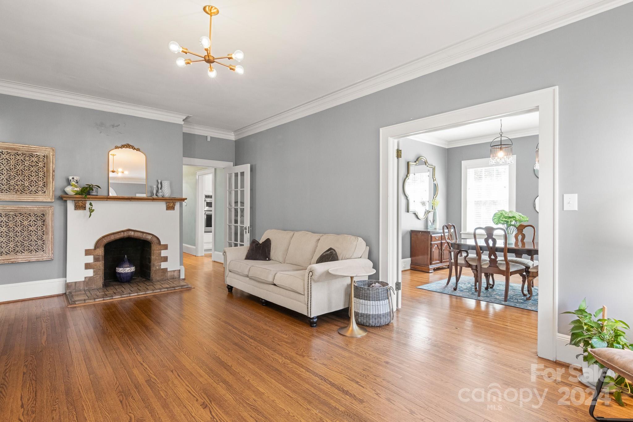 221 Ridgeway Avenue Statesville, NC 28677 - Photo 7 of 45 a living room with furniture and a fireplace