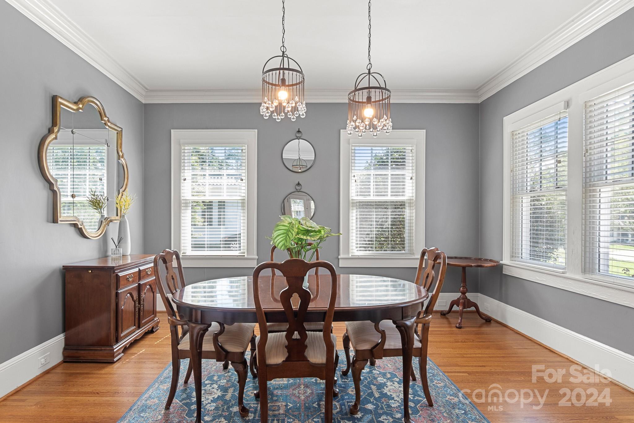 221 Ridgeway Avenue Statesville, NC 28677 - Photo 8 of 45 a view of a dining room with furniture window and wooden floor