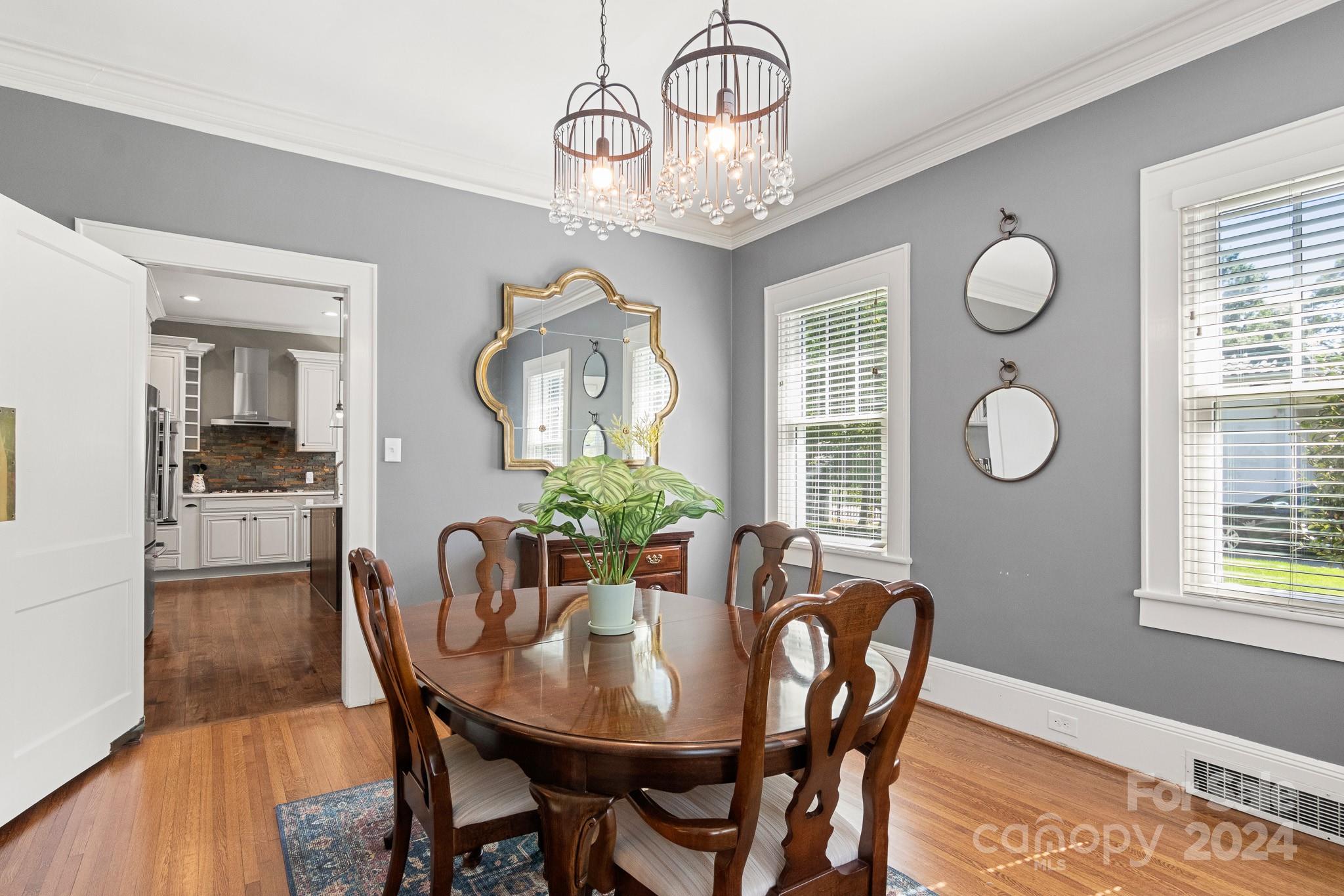 221 Ridgeway Avenue Statesville, NC 28677 - Photo 10 of 45 a view of a dining room with furniture window and wooden floor