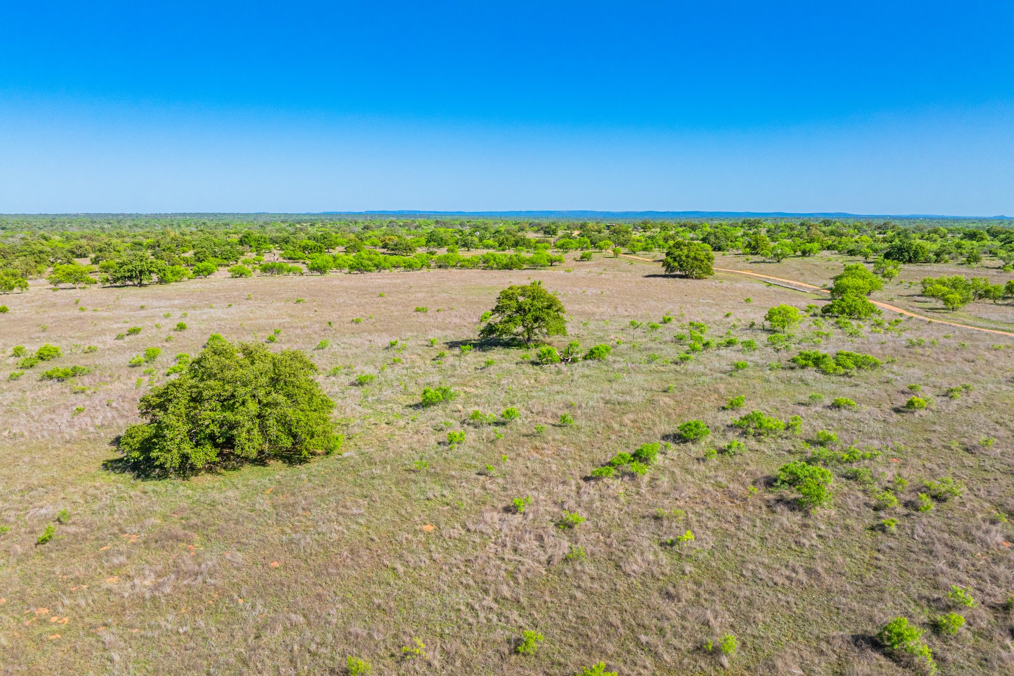 5230 County Road 409 Llano, TX 78643 - Photo 18 of 21 a view of a yard with an ocean