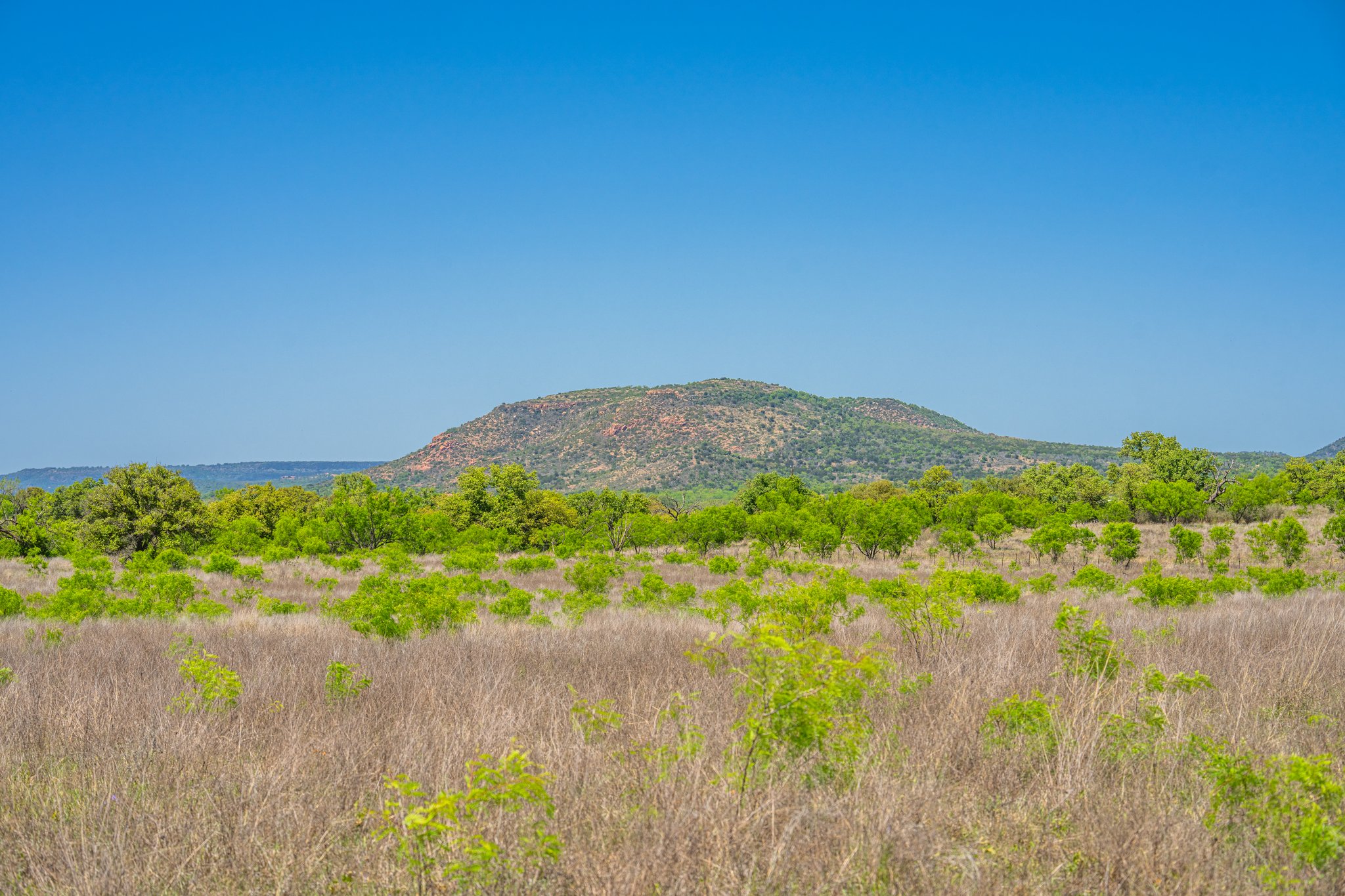 5230 County Road 409 Llano, TX 78643 - Photo 7 of 21 a view of a lake with a mountain in the background