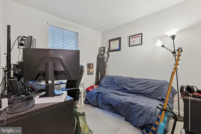 a bed room with a bed and a window