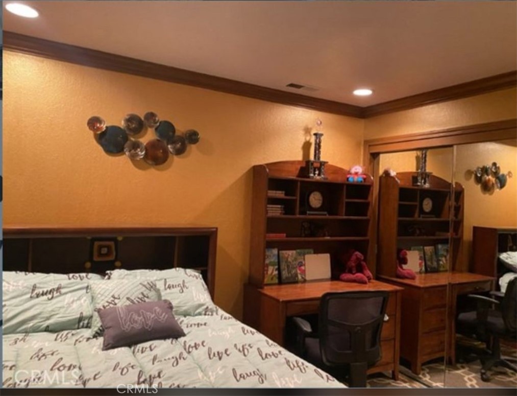 48 Jeanette Way Watsonville, CA 95076 - Photo 10 of 14 a bedroom with a bed window and cabinets
