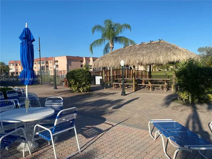a view of a swimming pool with a deck