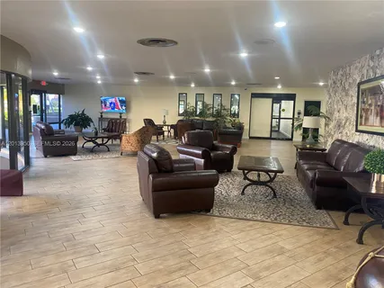 a room with pool table and windows