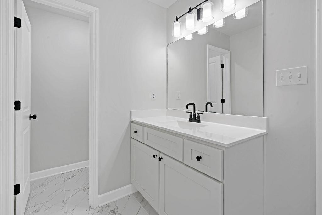 372 Edith Avenue Memphis, TN 38126 - Photo 14 of 23 Bathroom featuring vanity and light marble finish flooring