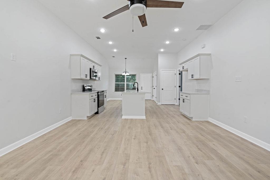 372 Edith Avenue Memphis, TN 38126 - Photo 18 of 23 Unfurnished living room featuring recessed lighting, ceiling fan, and light wood-style flooring