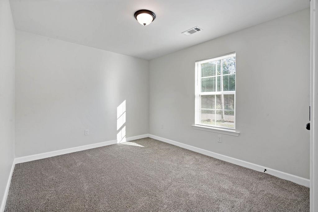 372 Edith Avenue Memphis, TN 38126 - Photo 6 of 23 Carpeted spare room featuring baseboards