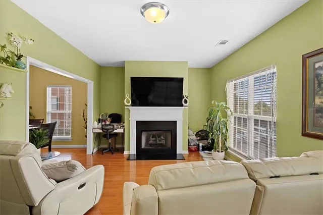 a living room with furniture and a fireplace