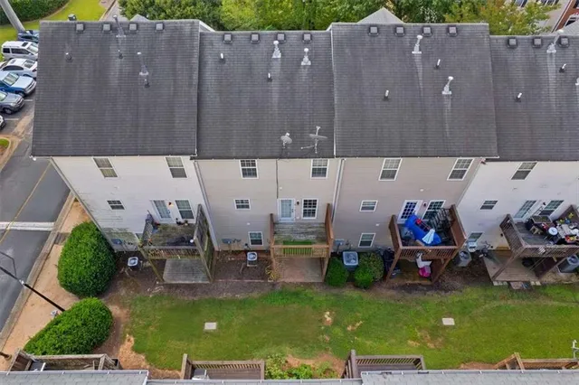 an aerial view of residential houses with outdoor space