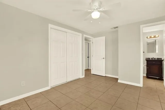 a bathroom with a sink toilet vanity and shower