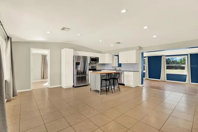 a view of kitchen with furniture and window