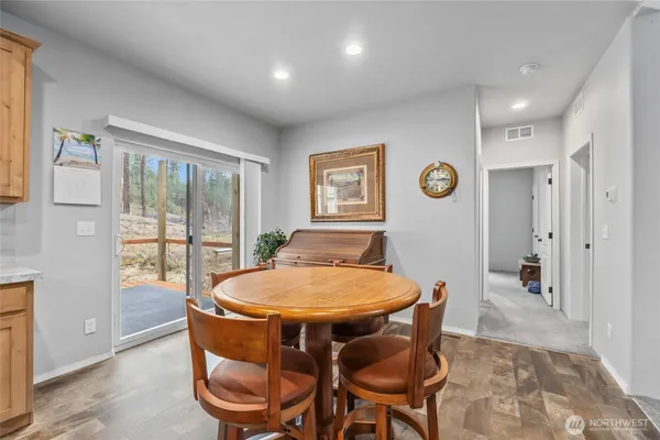 a dining room with furniture and window