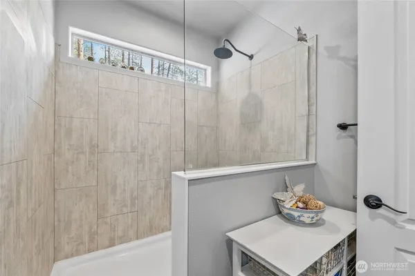 a bathroom with a shower curtain and a sink