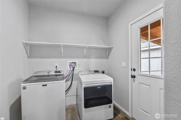 a utility room with dryer and washer