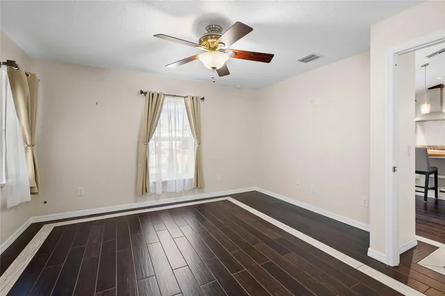 a backyard of a house with table and chairs
