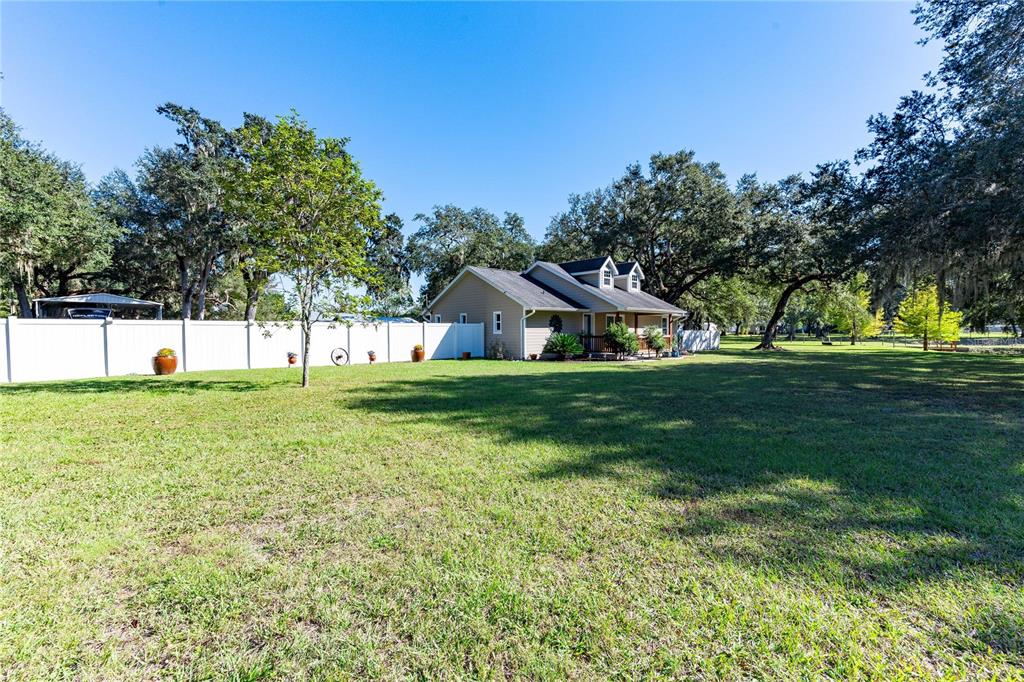 7037 County Road 625 Bushnell, FL 33513 - Photo 35 of 72 a view of an house with a big yard