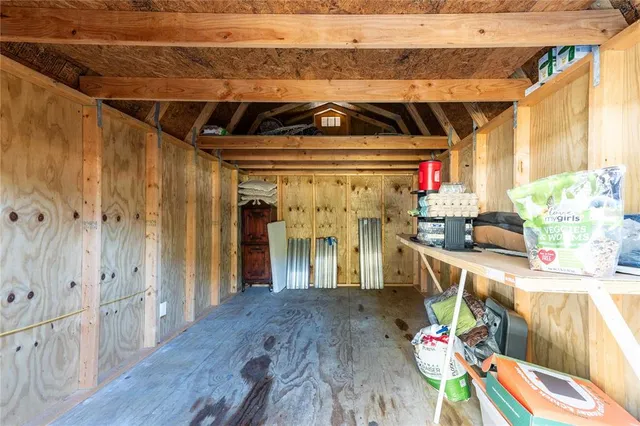 a view of a swimming pool with an outdoor seating and a yard