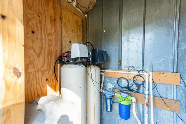 a view of a swimming pool with a patio and a yard