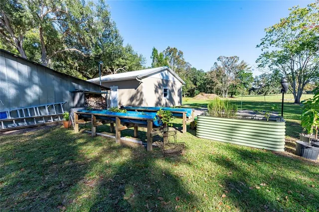 a view of a swimming pool with an outdoor space and seating area
