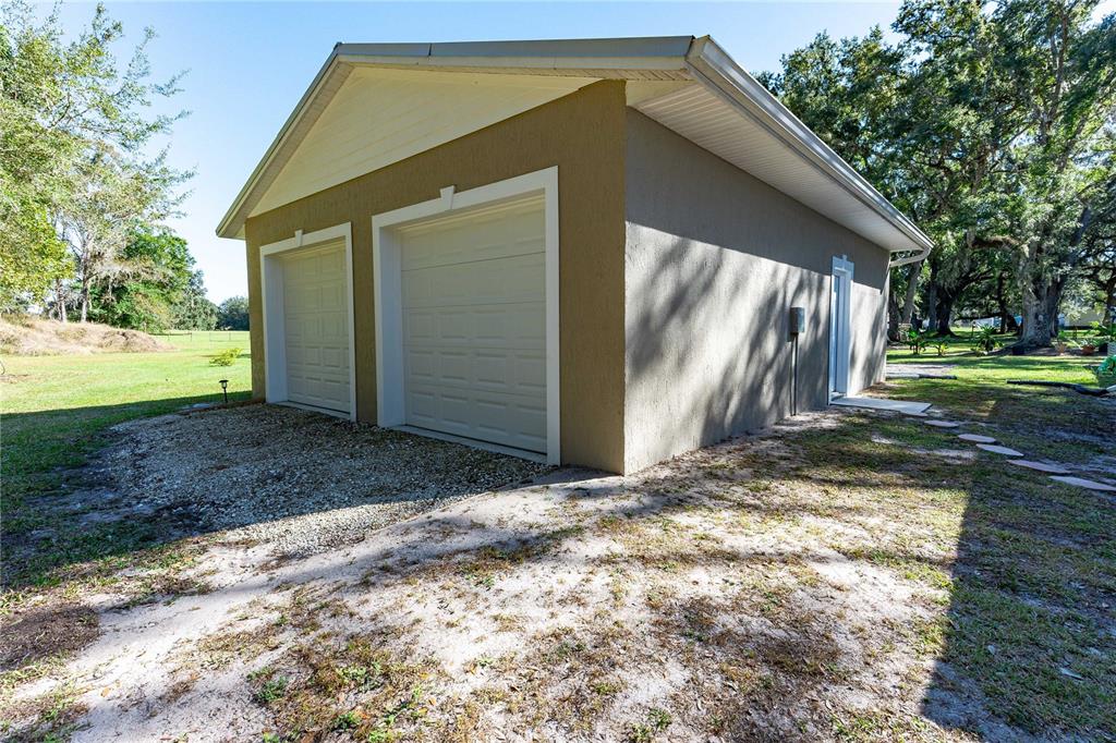 7037 County Road 625 Bushnell, FL 33513 - Photo 50 of 72 a view of a house with backyard and trees