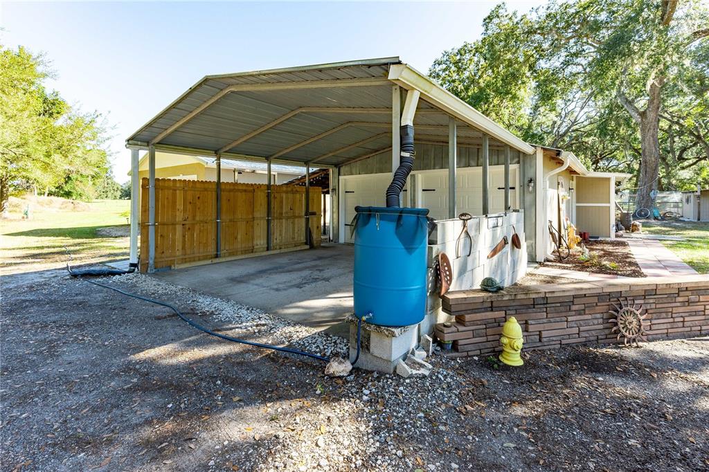 7037 County Road 625 Bushnell, FL 33513 - Photo 51 of 72 a front view of a house with garden