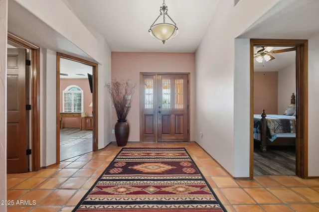 a living room with furniture a rug and a window