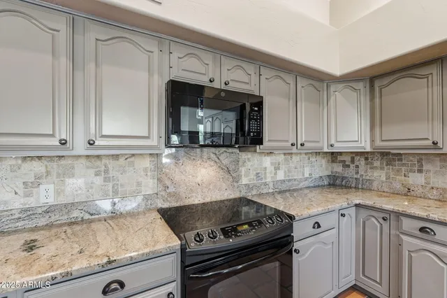 a bedroom with a bed and furniture