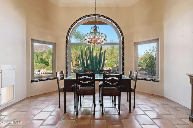 a spacious bathroom with a double vanity sink a mirror and a