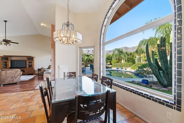 a bathroom with a bathtub a window and a shower