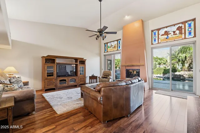 a bathroom with a tub a sink and a large mirror